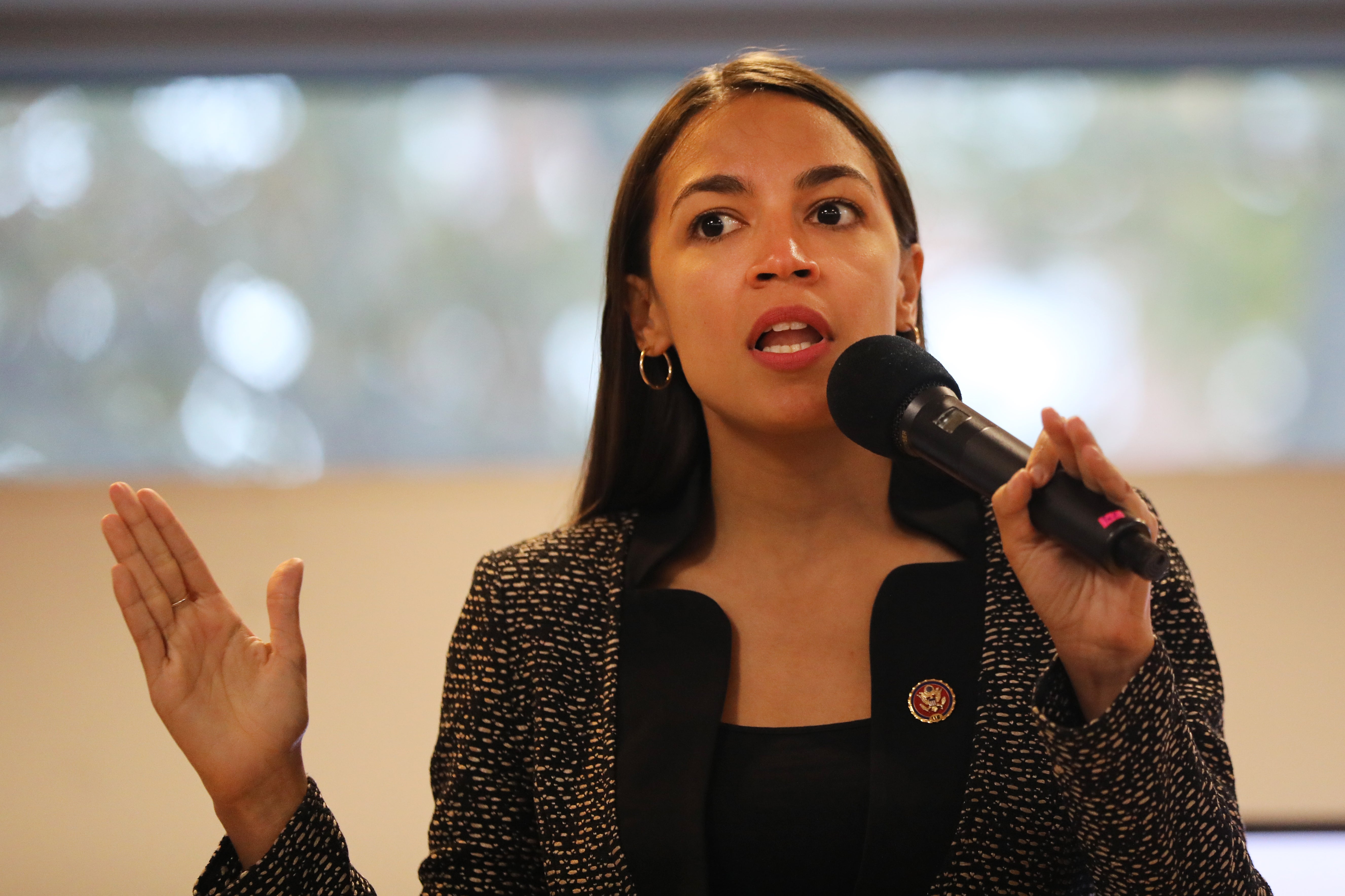 AOC hits back at right-wing host who said she left grandmother in