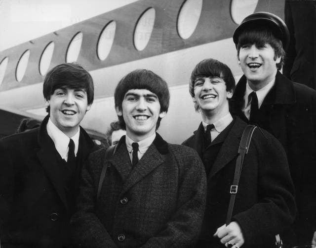 <p>The Beatles arriving at London Airport after a trip to Paris in 1964</p>
