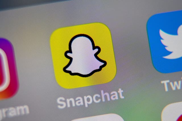 A picture taken on October 1, 2019 in Lille shows the logo of mobile app Snapchat displayed on a tablet.