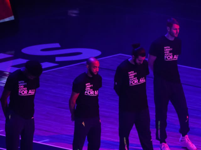 Minnesota Timberwolves players where T-shirts promoting social justice