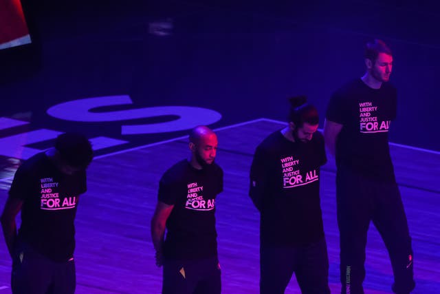 Minnesota Timberwolves players where T-shirts promoting social justice