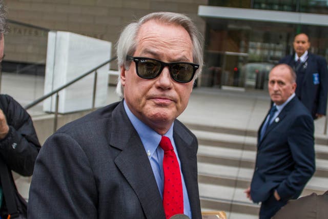 <p>Attorneys L. Lin Wood (C) and Mark Stephen (L) speak to the media about their client, British rescue diver Vernon Unsworth (rear), as they arrive at US District Court on 3 December 2019 in Los Angeles, California</p>