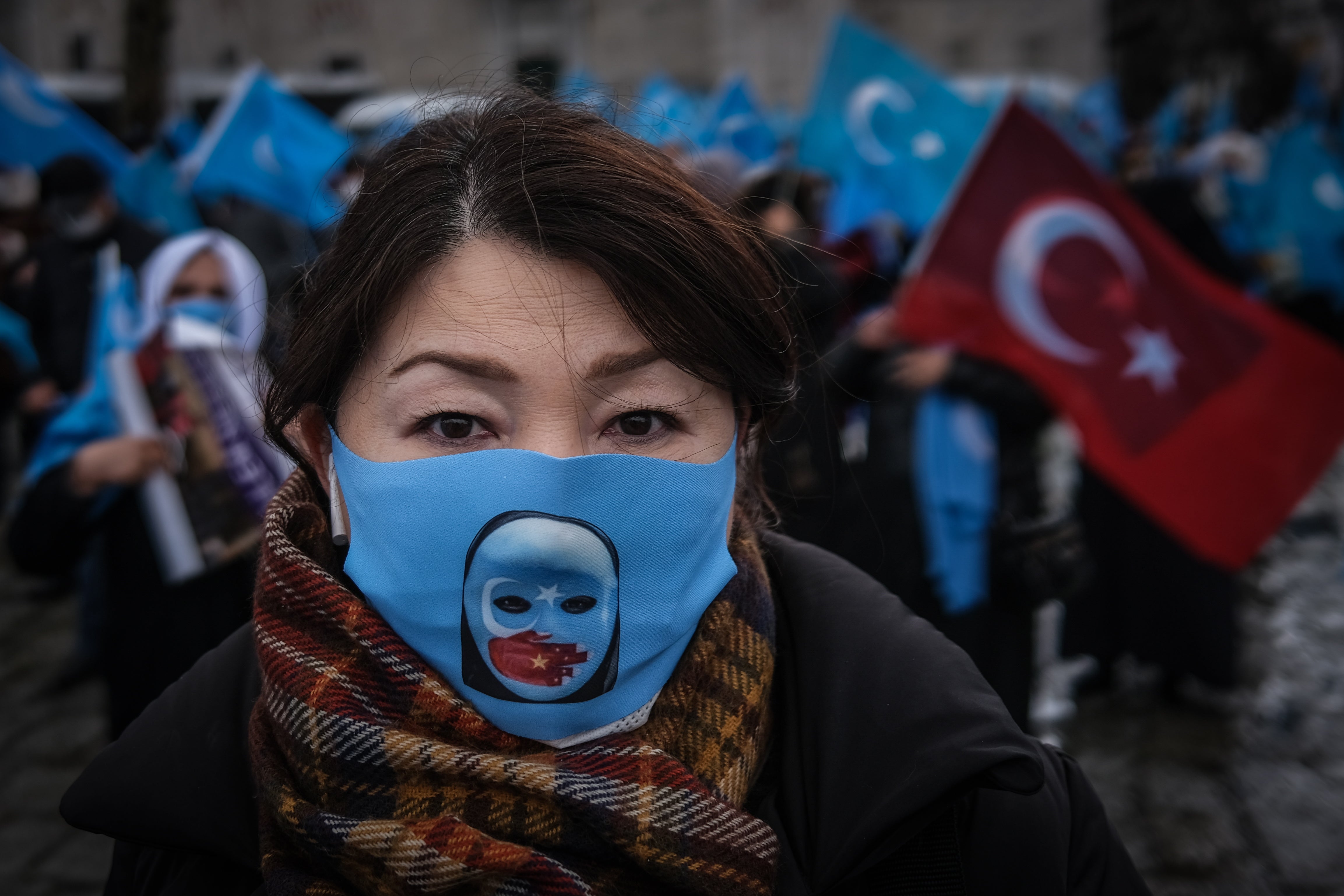 Uighur protesters who have not heard from their families living in East Turkestan demonstrate against China in Istanbul