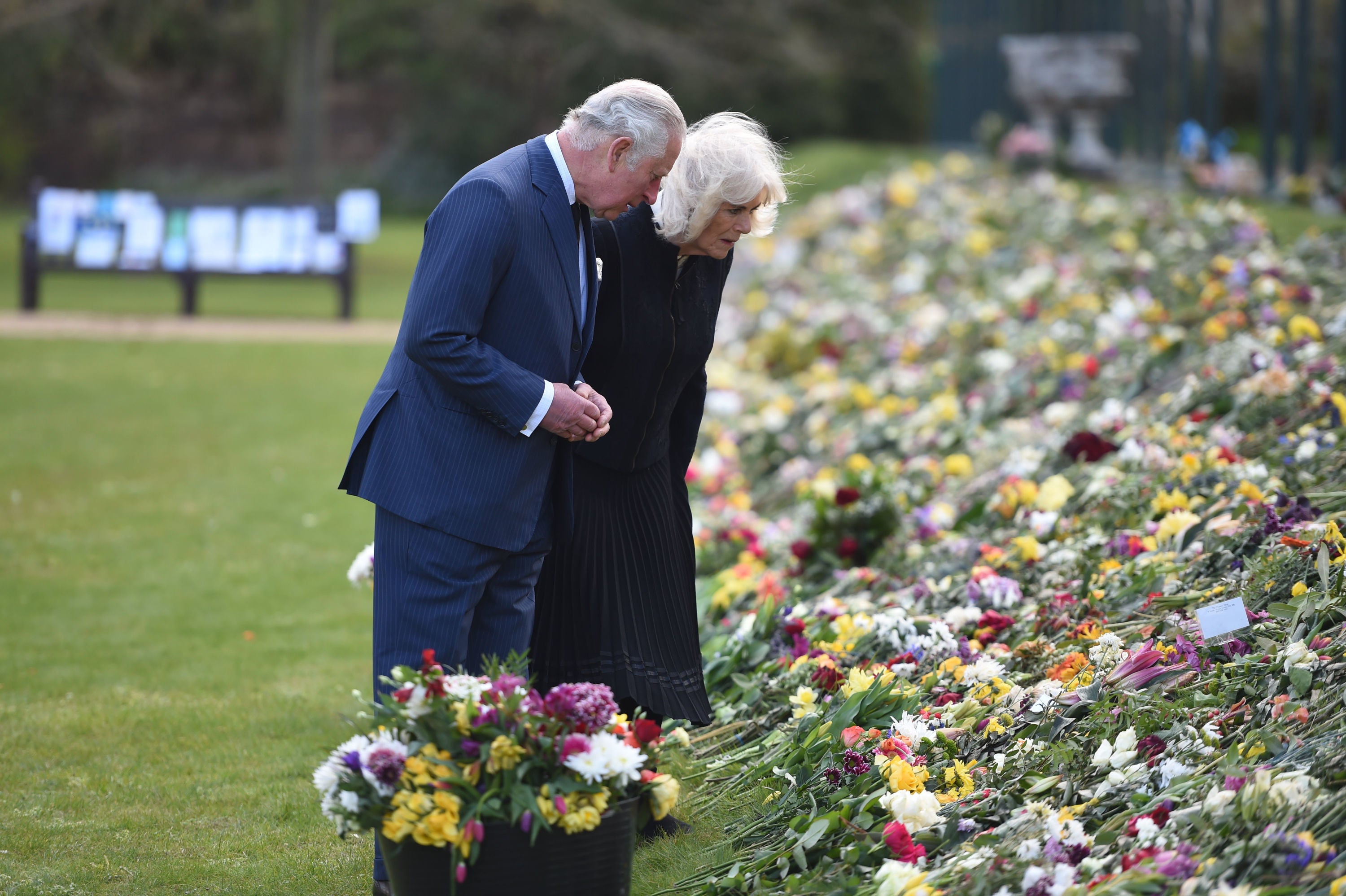 The Prince of Wales and the Duchess of Cornwall visit the gardens of Marlborough House, London, to view the flowers and messages left by members of the public outside Buckingham Palace