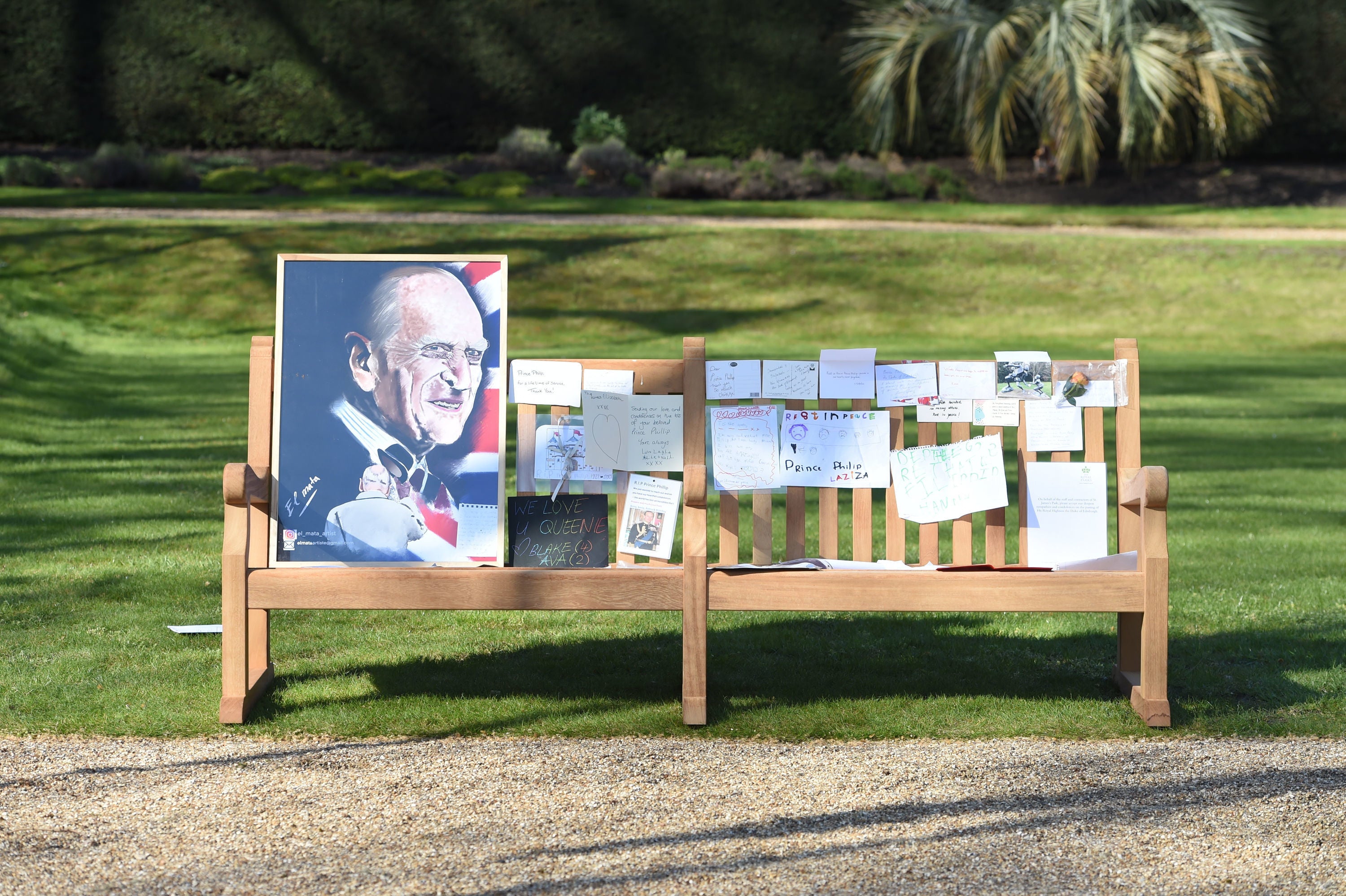 Notes and artwork left by members of the public outside Buckingham Palace following the death of the Duke of Edinburgh on display in the gardens of Marlborough House, London