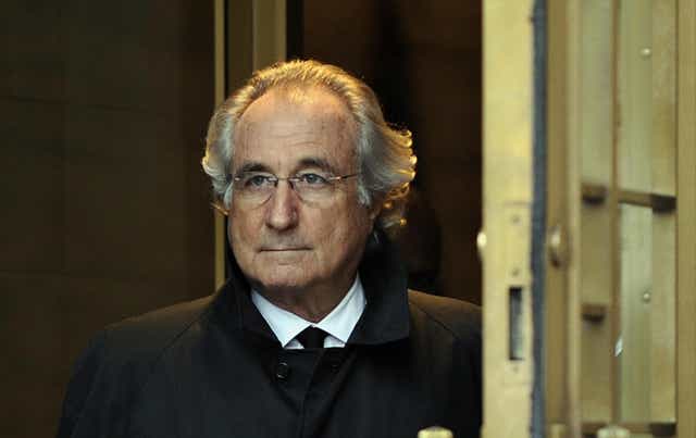 <p>Bernard Madoff leaves US Federal Court while being investigated for fraud in 2009</p>