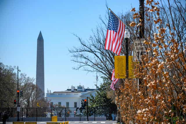 The Stars and Stripes hangs over Black Lives Matter Plaza in Washington DC – with an extra star symbolising the ambition of making the District of Columbia the 51st state of the USA