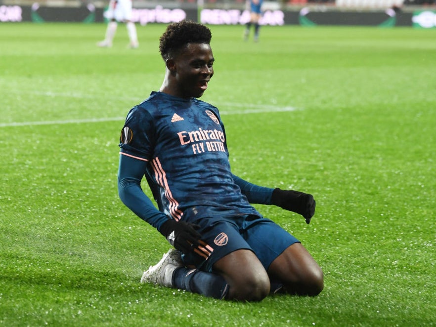 Bukayo Saka celebrates scoring against Slavia Prague