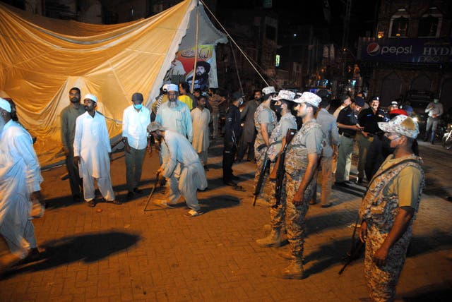 <p>Pakistani security officials remove the protest camp set up by supporters of Islamic political party Tehreek-e-Labbaik Pakistan (TLP) following violent anti-France protests, in Hyderabad, Pakistan</p>