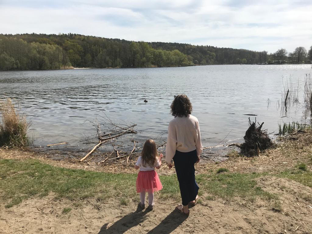 Juliette with her four-year-old daughter on a walk around a lake in West Berlin. The family moved to Germany in January 2020 with the toddler and a 12-week-old baby.