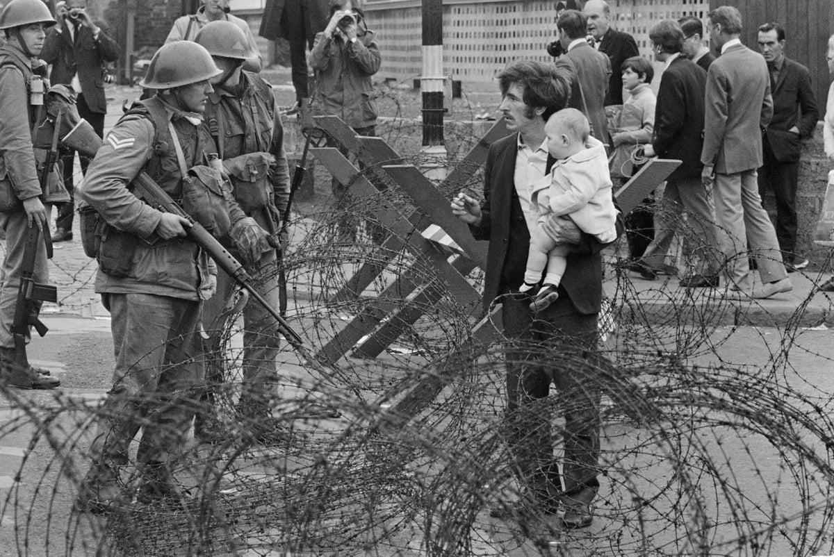 Soldiers and civilians in Northern Ireland during The Troubles, 16th August 1969.