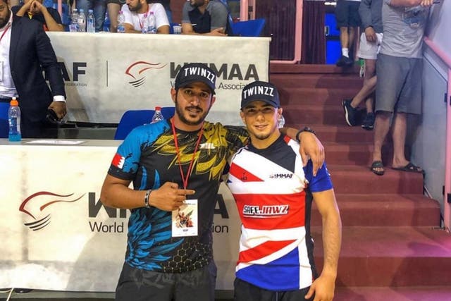 <p>Mr Mokaev (right), a six-time British wrestling champion and UK refugee, said he was struggling to focus on the sport due to the Home Office’s decision</p>
