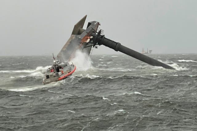 <p>A Coast Guard response boat heads toward a capsized 175-foot commercial lift boat  searching for people in the water 8 miles south of Grand Isle, Louisiana</p>