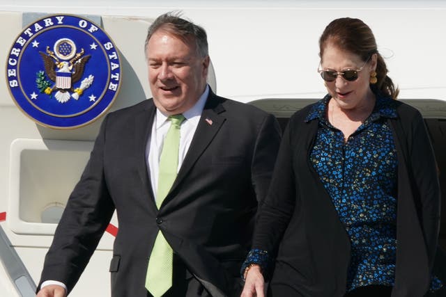 <p>US Secretary of State Mike Pompeo (L) and his wife Susan disembark their plane at Warsaw's Chopin airport as they arrive for a day visit to Poland, on August 15, 2020</p>