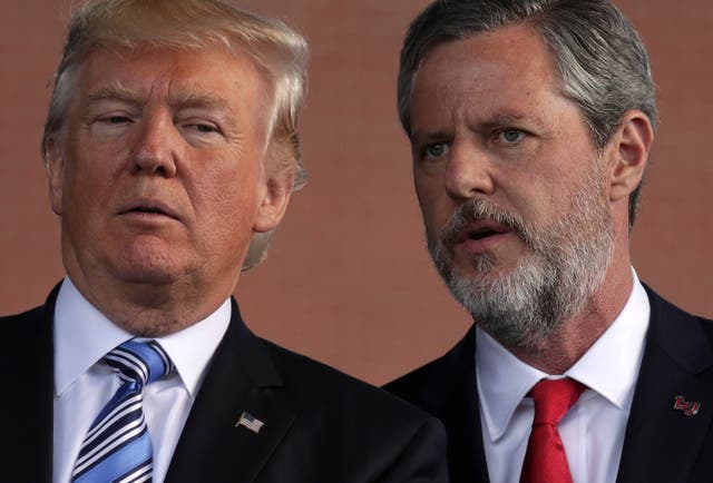 <p>U.S. President Donald Trump (L) and Jerry Falwell (R), President of Liberty University, on stage during a commencement at Liberty University May 13, 2017 in Lynchburg, Virginia</p>