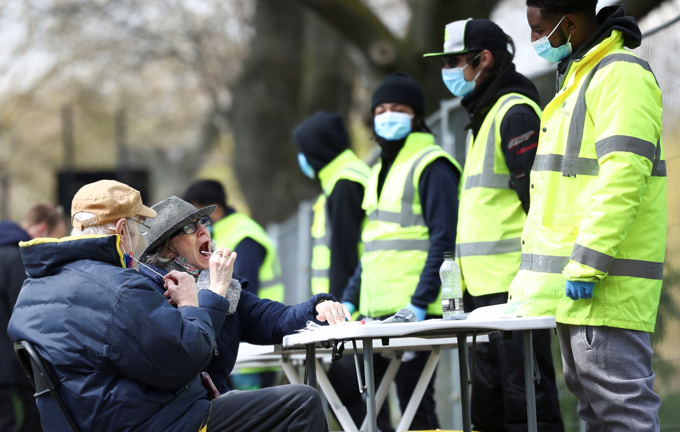 People swab themselves at a Covid-19 testing site on Clapham Common in south London