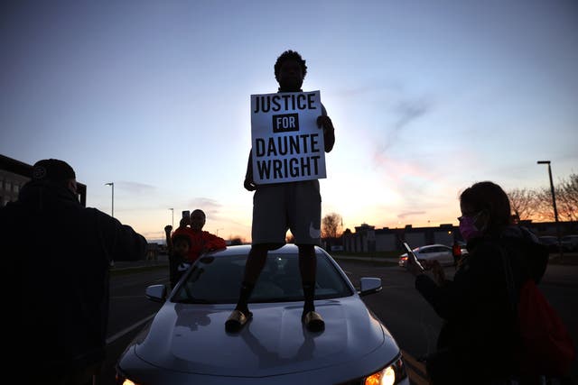 <p>Protest near the Brooklyn Center police station on 16 April  in Minnesota in the wake of the fatal shooting of 20-year-old Daunte Wright by Brooklyn Center police officer </p>