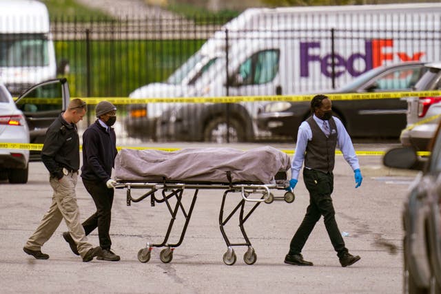 <p>A body is taken from the Indianapolis FedEx facility after eight people were shot dead on 15 April</p>