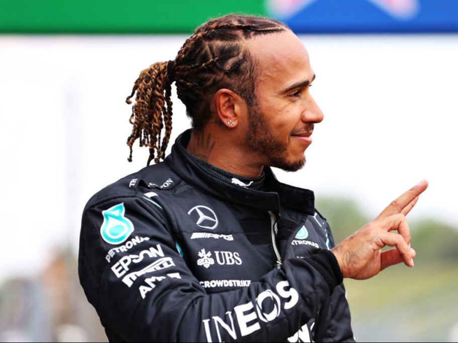 Lewis Hamilton celebrates clinching pole position