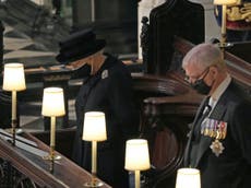 Prince Philip funeral – live: Queen leads nation in silence as William and Harry sit apart at ceremony