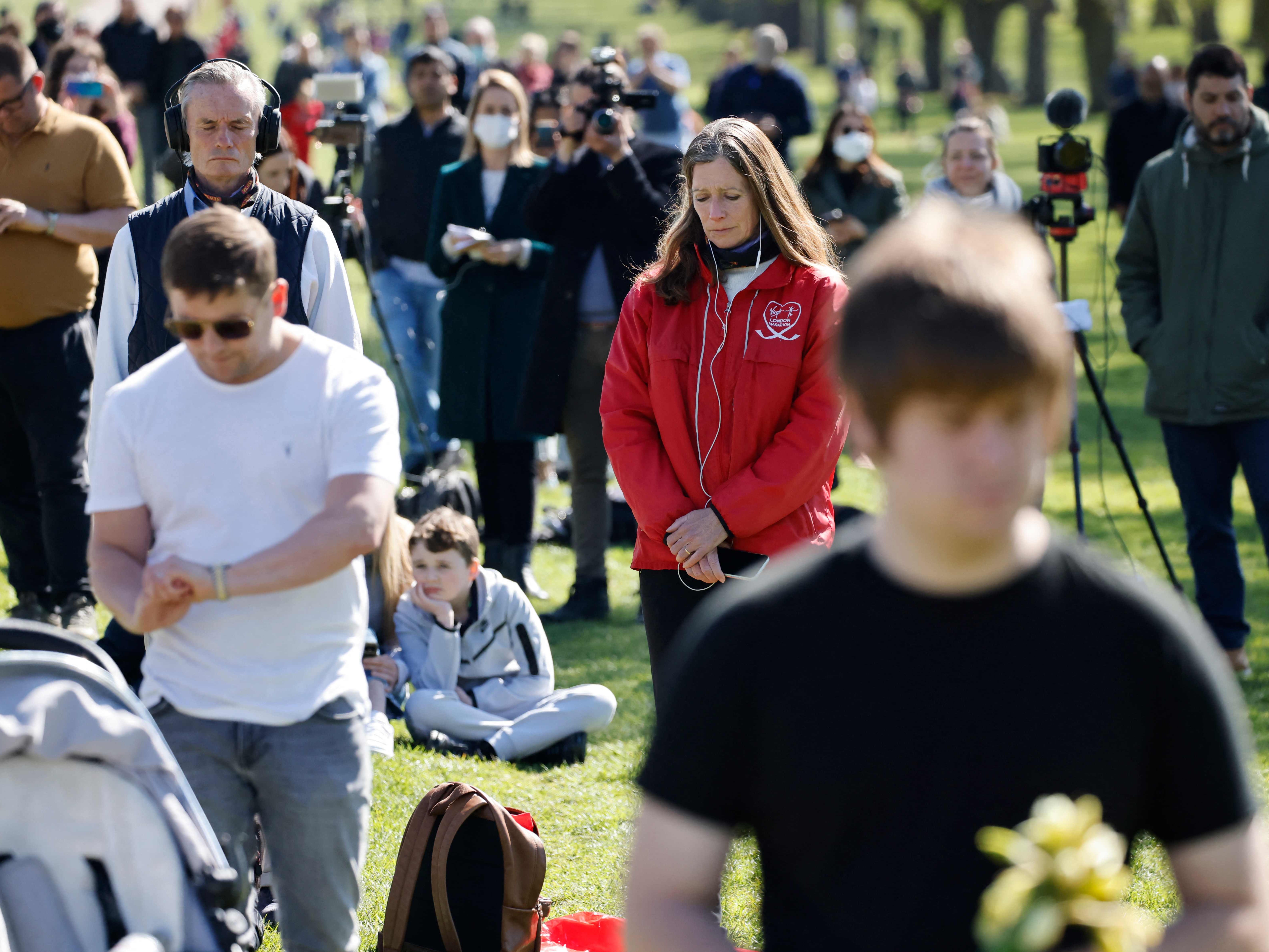 Members of the public observe a minute’s silence on the Long Walk in Windsor during Prince Philip’s funeral