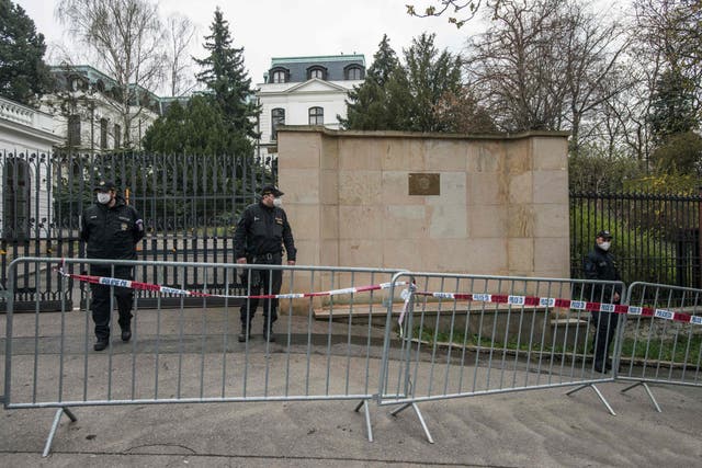 <p>Police officers form a cordon as protesters gather in front of the Russian Embassy on 18 April, 2021 in Prague.</p>