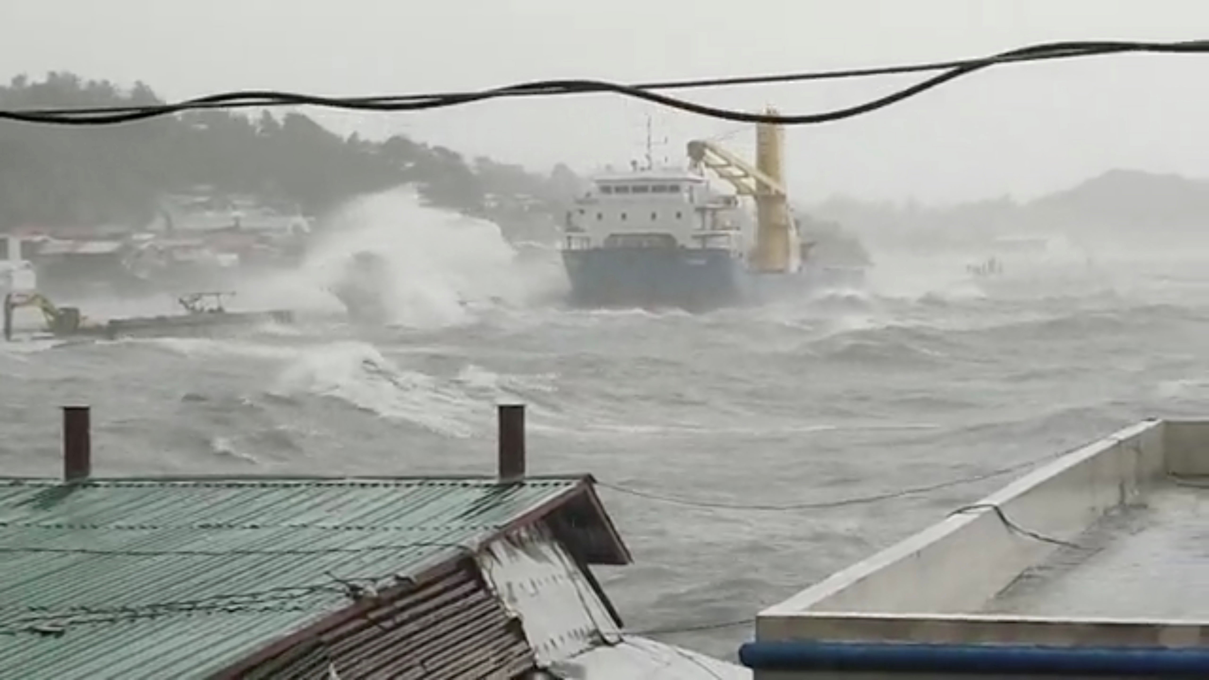 Waves crash the shore as Super Typhoon Surigae moves close to the Philippines in the province of Catbalogan, Samar, Philippines April 18, 2021, in this screen grab obtained from a social media video.