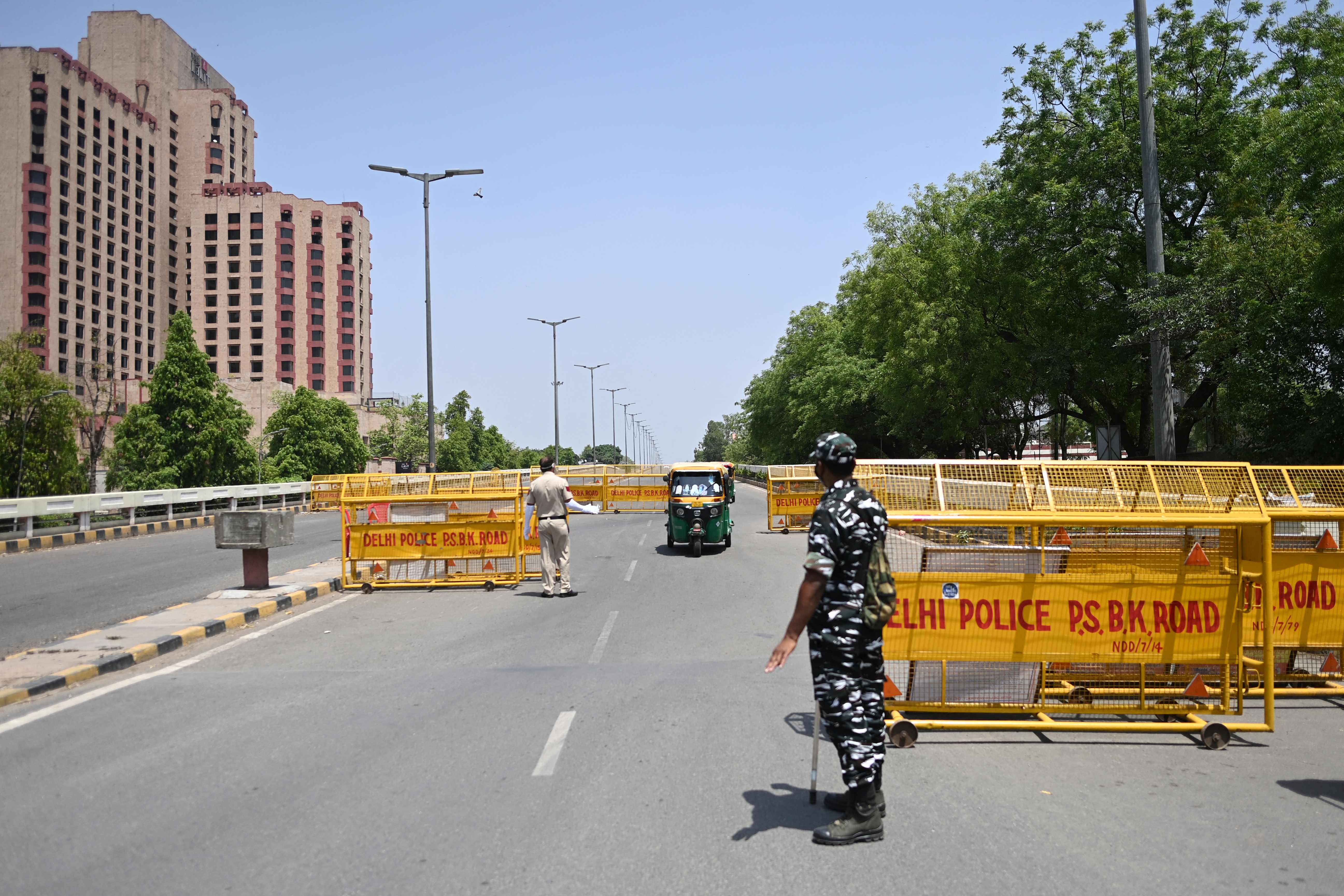 Police personnel at a checkpoint during a weekend lockdown imposed by Delhi on 18 April, 2021.