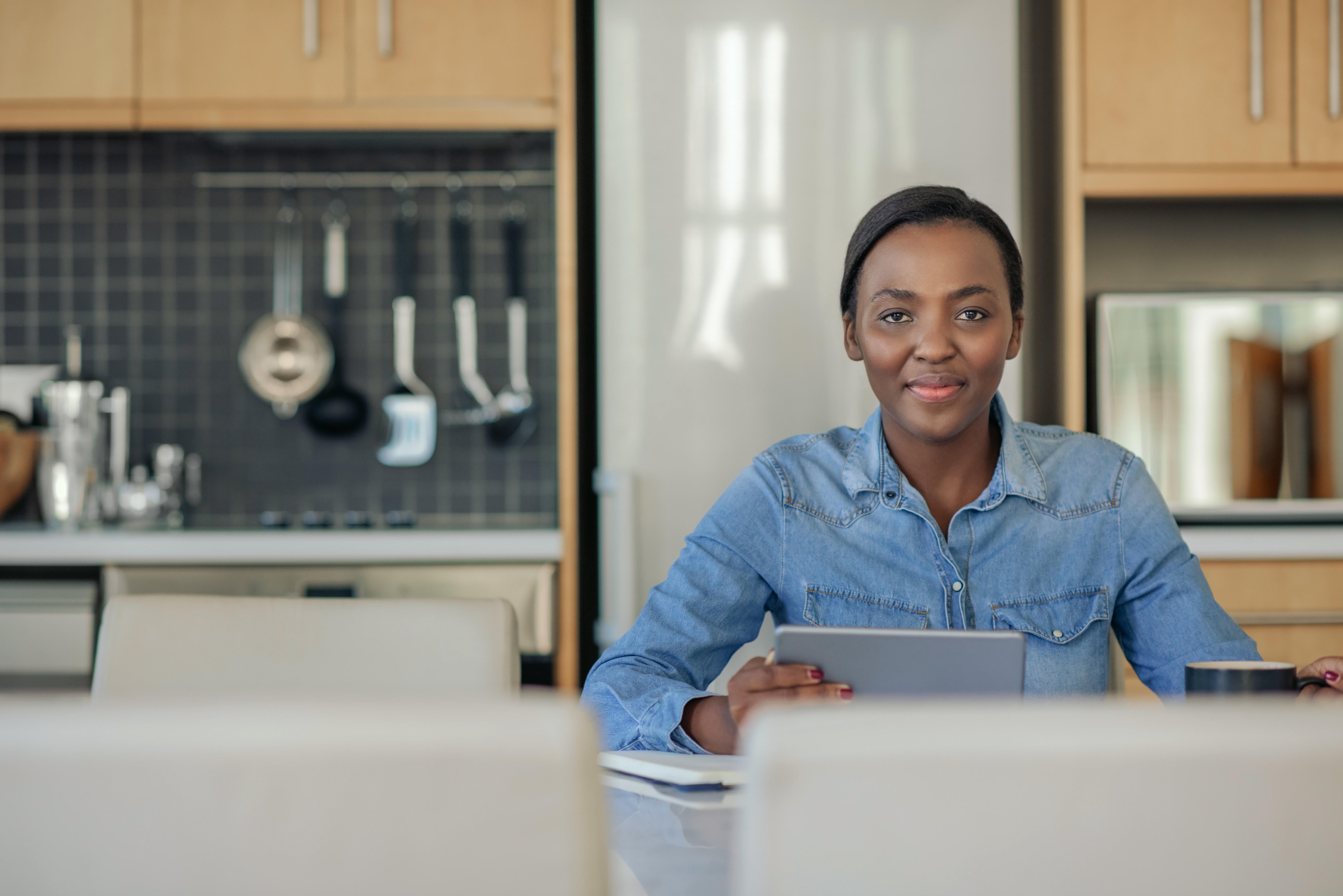 Woman using tablet at home