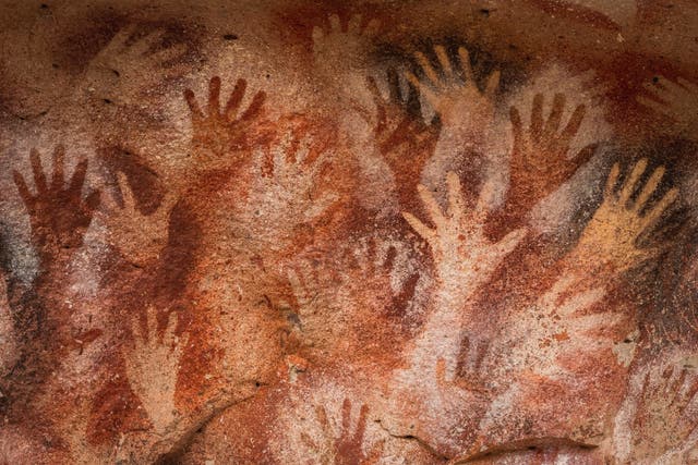 <p>Prehistoric hand paintings at the Cave of Hands in Argentina, thought to be over 10,000 years old</p>