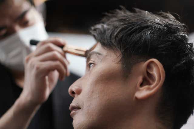 <p>A man gets his make-up done at a salon in Tokyo.  Businessmen have been visiting them in increasing numbers during the pandemic</p>