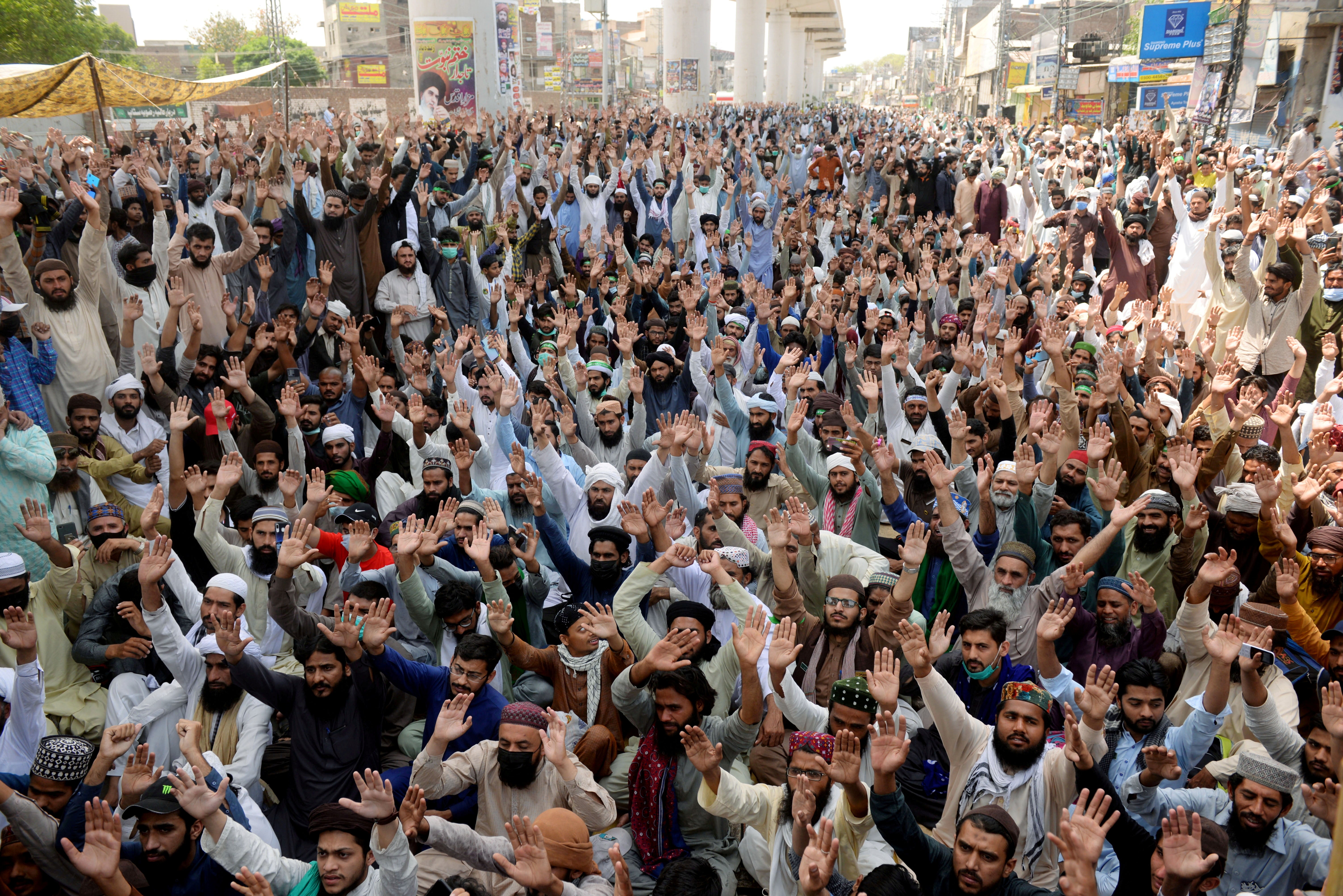 Supporters of the banned Islamist political party Tehrik-e-Labaik Pakistan (TLP) chant slogans during a protest in Lahore