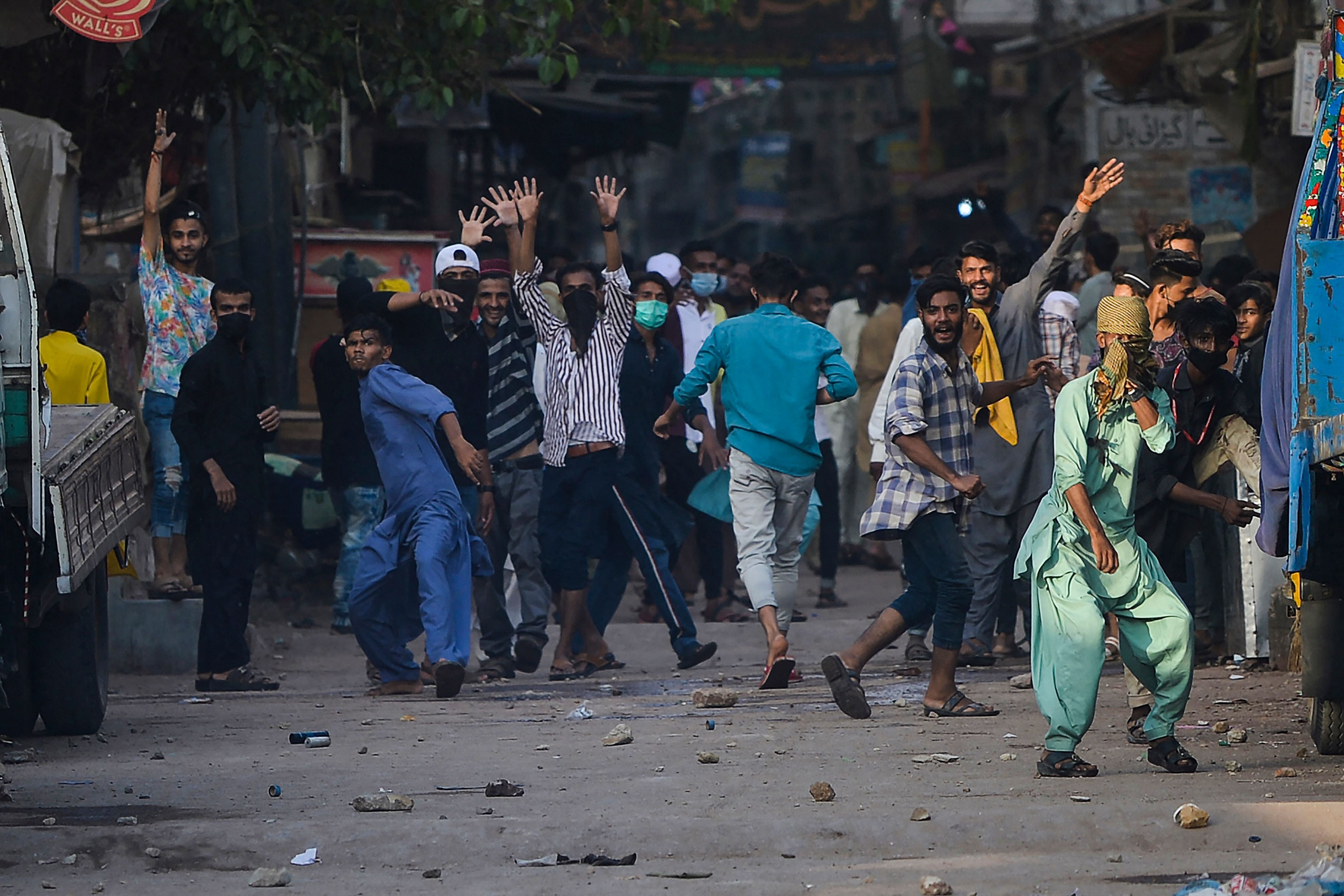 TLP supporters pelt stones in Karachi on Monday after a nationwide shutdown was announced