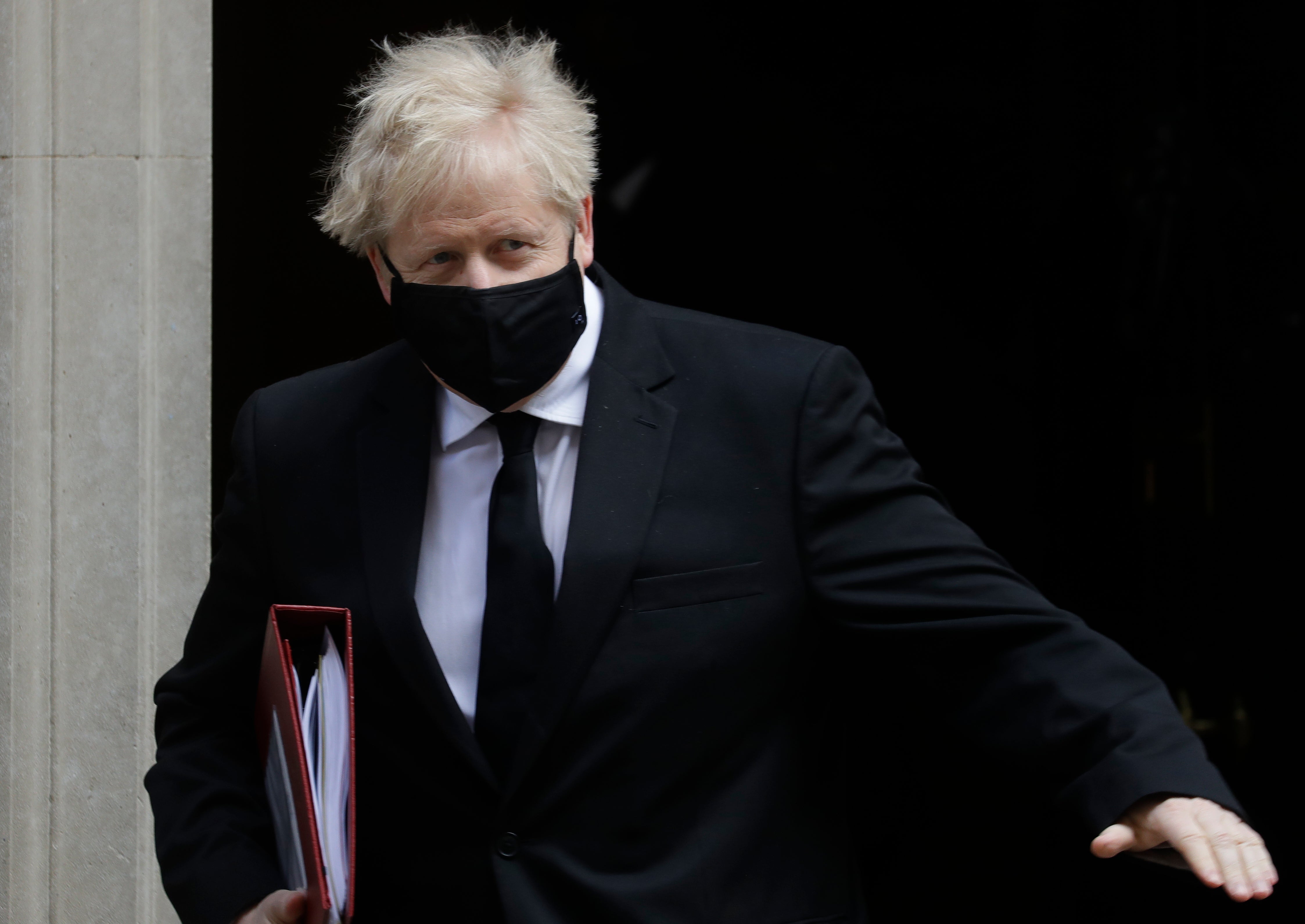 Boris Johnson leaves the building that includes a tastefully refurbished flat