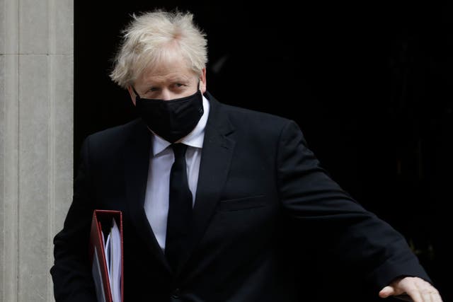 <p>Boris Johnson leaves the building that includes a tastefully refurbished flat</p>