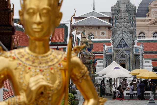 Visitors tour the Temple of the Emerald Buddha at the Grand Palace in Bangkok, Thailand (file picture)