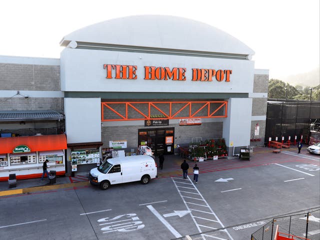 <p>Customers enter a Home Depot store on November 19, 2019 in Colma, California</p>