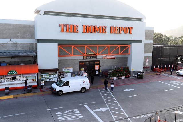 <p>Customers enter a Home Depot store on November 19, 2019 in Colma, California</p>