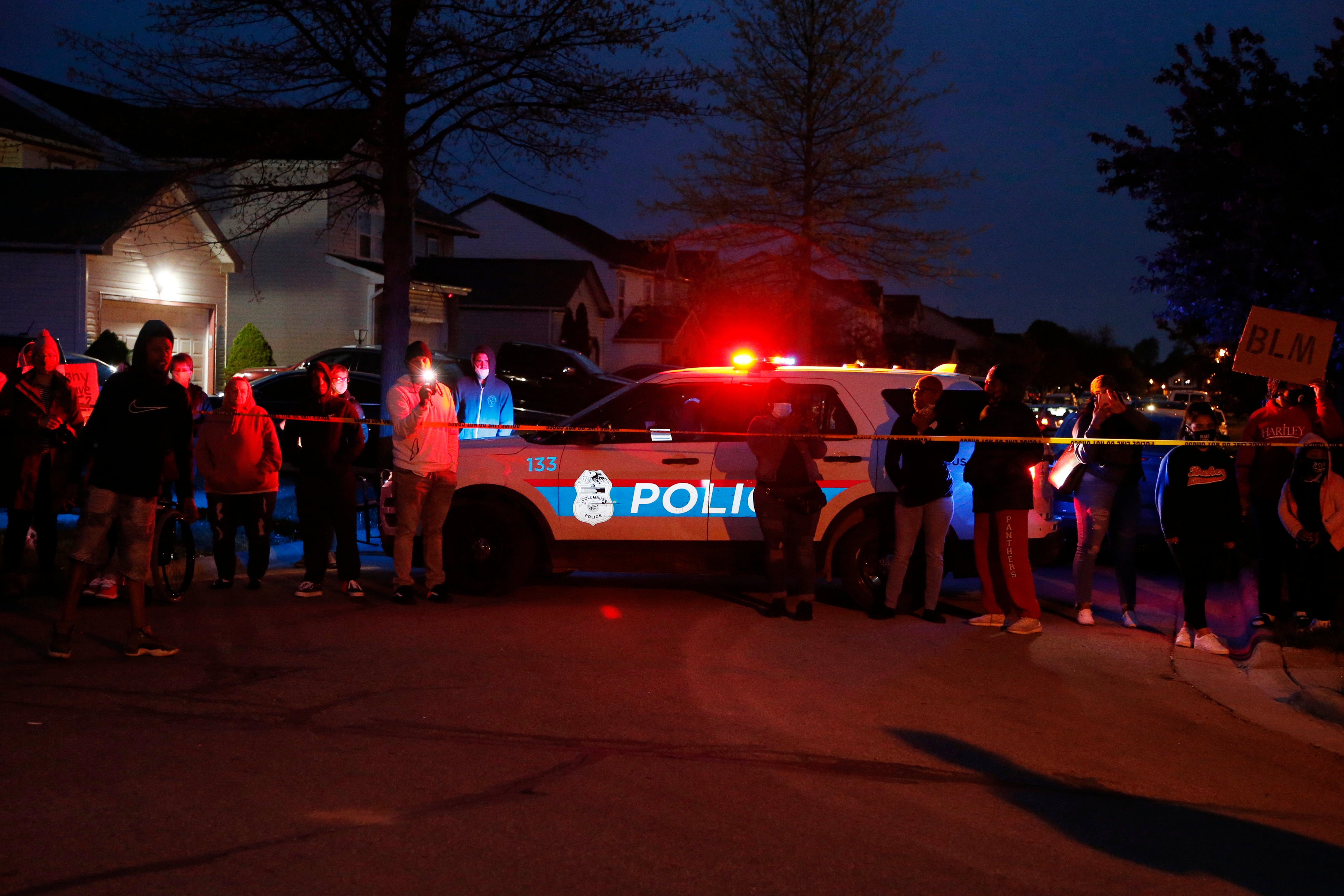 <p>A crowd gathers to protest in the neighbourhood where a Columbus police officer fatally shot a teenage girl on Tuesday</p>