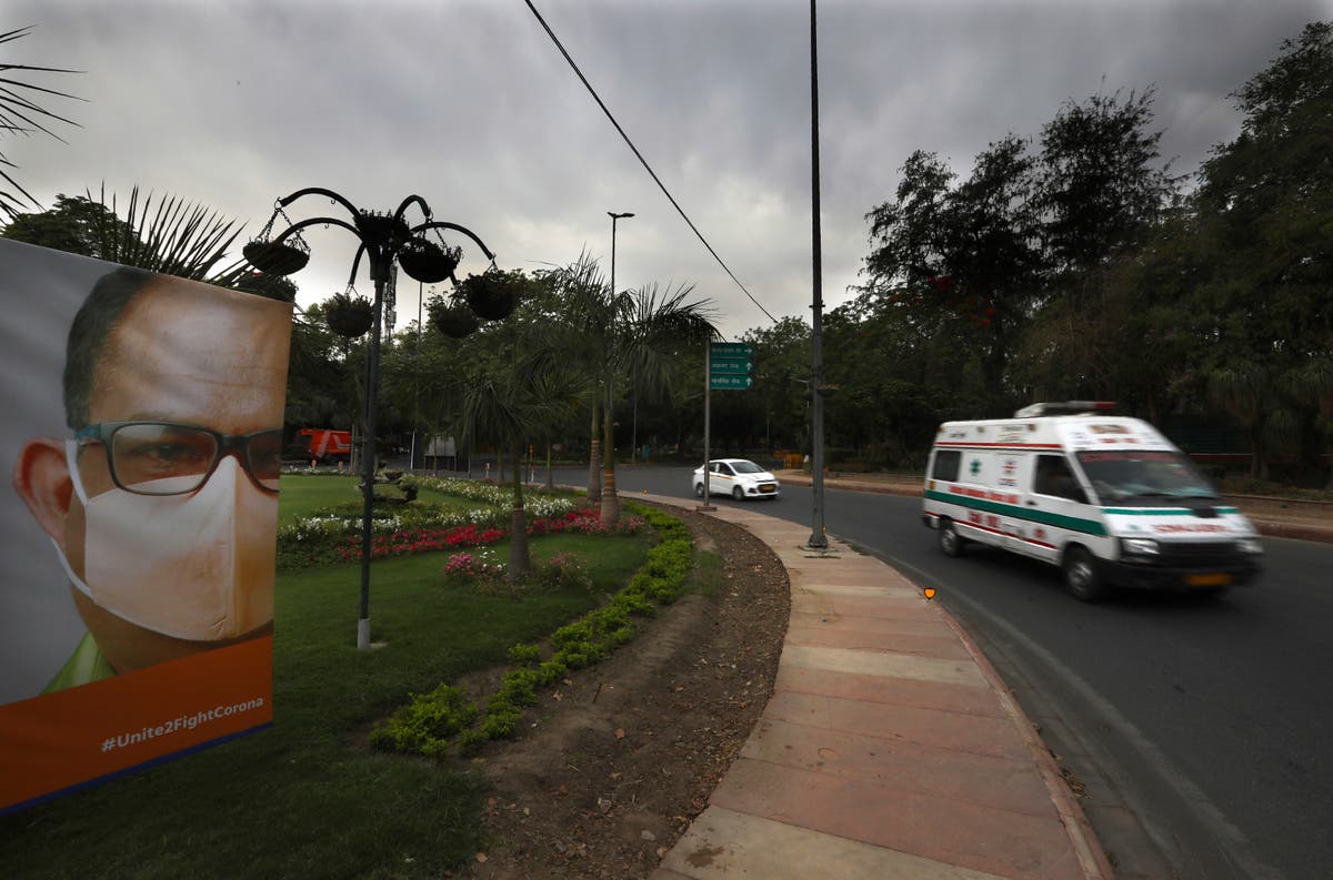The Latest: India reports new record number of cases, deaths