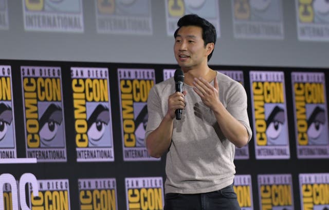 <p>File image: Simu Liu speaks on stage for the Marvel panel in Hall H of the Convention Center during Comic Con in San Diego in 2019</p>