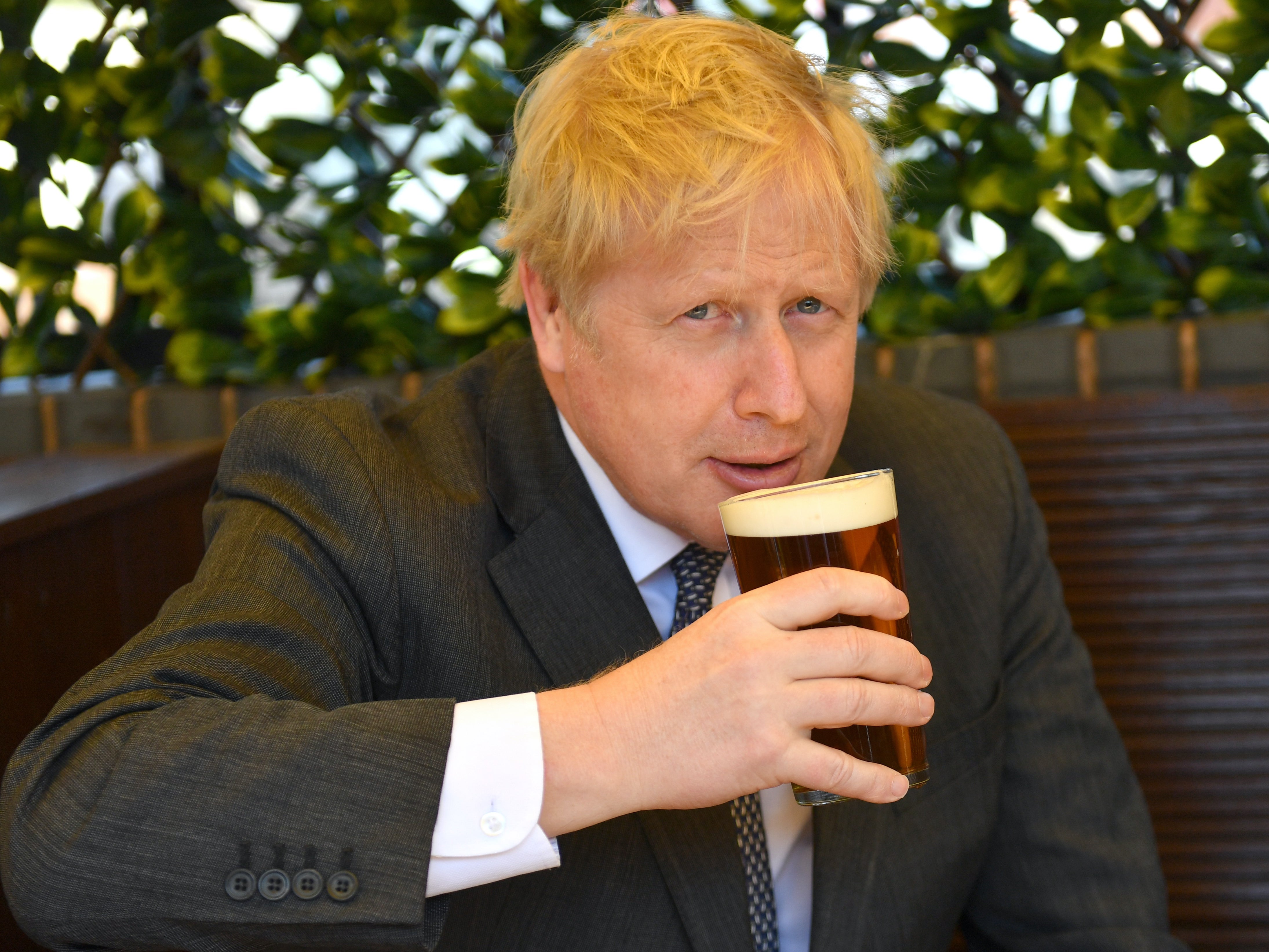 Boris Johnson sips a pint on the local election campaign trail