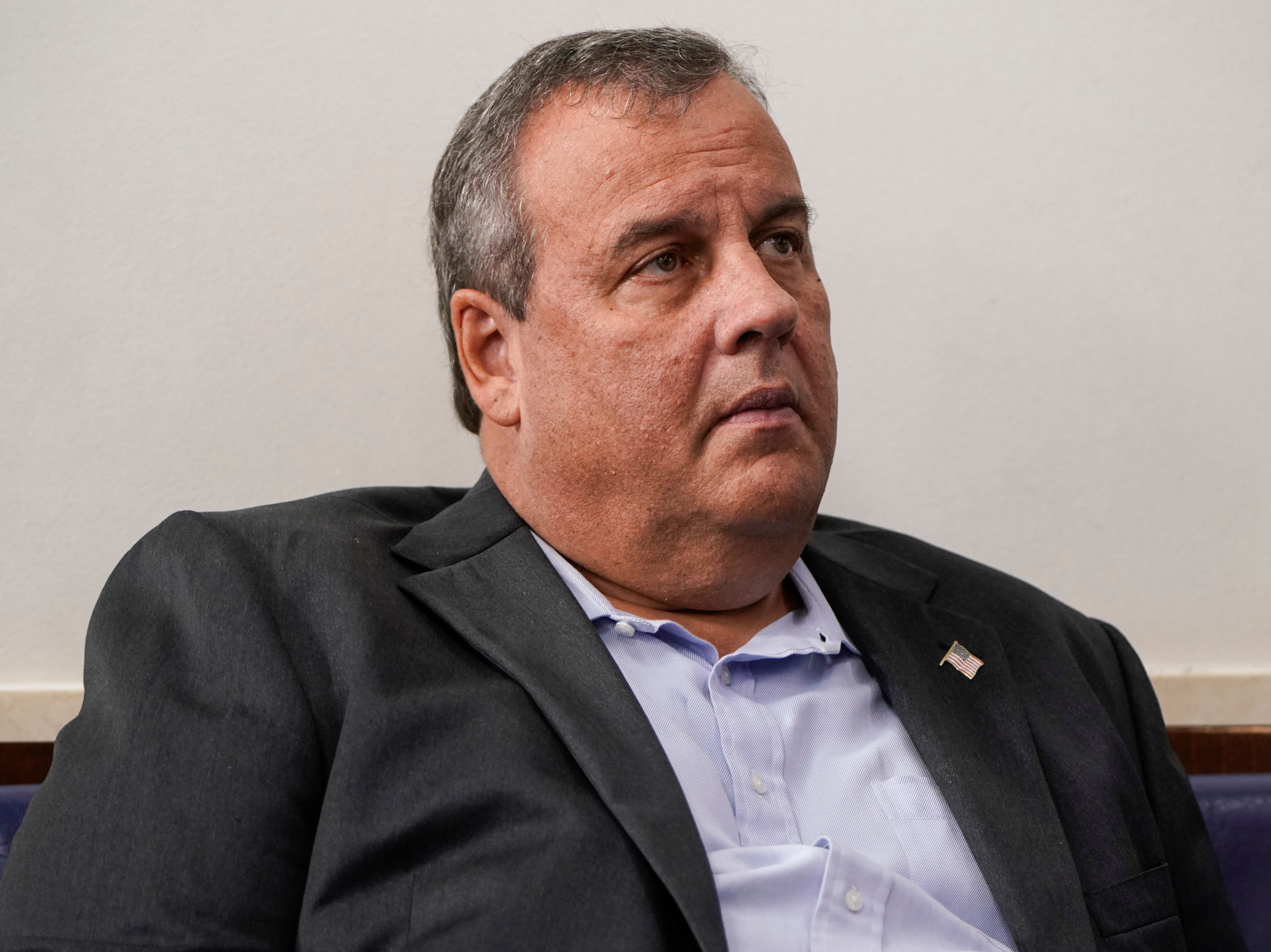 Former New Jersey Governor Chris Christie listens as US President Donald Trump speaks during a news conference in the Briefing Room of the White House on 27 September, 2020 in Washington, DC