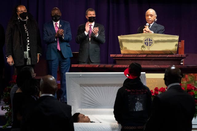 <p>The Rev. Al Sharpton, right, speaks over the casket of Daunte Wright, alongside attorneys Antonio Romanucci, center, and Ben Crump, center left, and the Rev. Greg Drumwright, left, Wednesday, April 21, 2021, in Minneapolis. The 20-year-old Wright was killed by former Brooklyn Center police Officer Kim Potter during a traffic stop. </p>