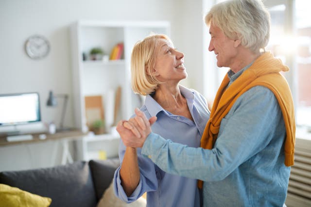 Couple dancing at home