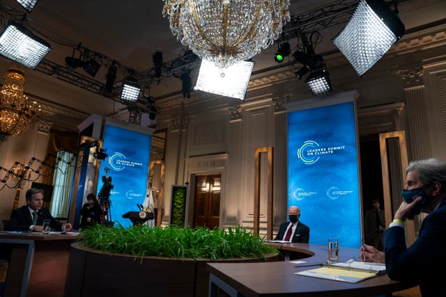 Secretary of State Antony Blinken, President Joe Biden, and Special Presidential Envoy for Climate John Kerry listen during a virtual Leaders Summit on Climate, from the East Room of the White House on Earth Day, April 22