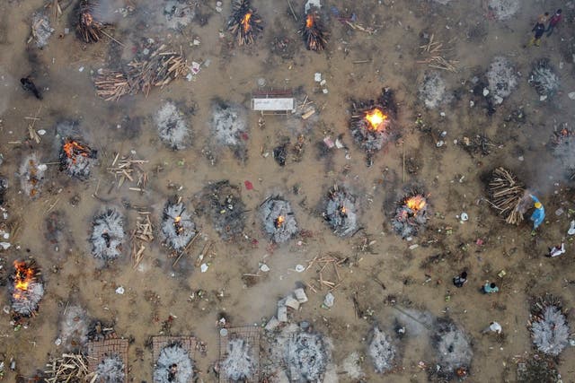 A mass cremation takes place in New Delhi, India, on 22 April, 2021, for victims who died from Covid-19. 