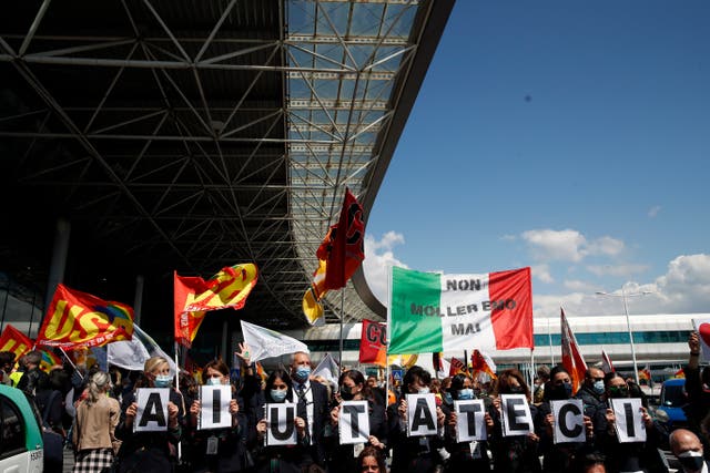 <p>‘Help us’: Alitalia workers stage a protest at Rome’s airport in April</p>