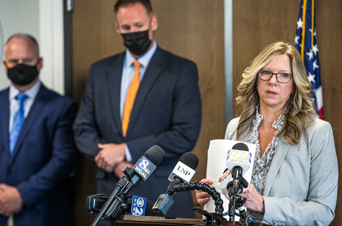 Coroner says buried Amish teen had been strangled, stabbed