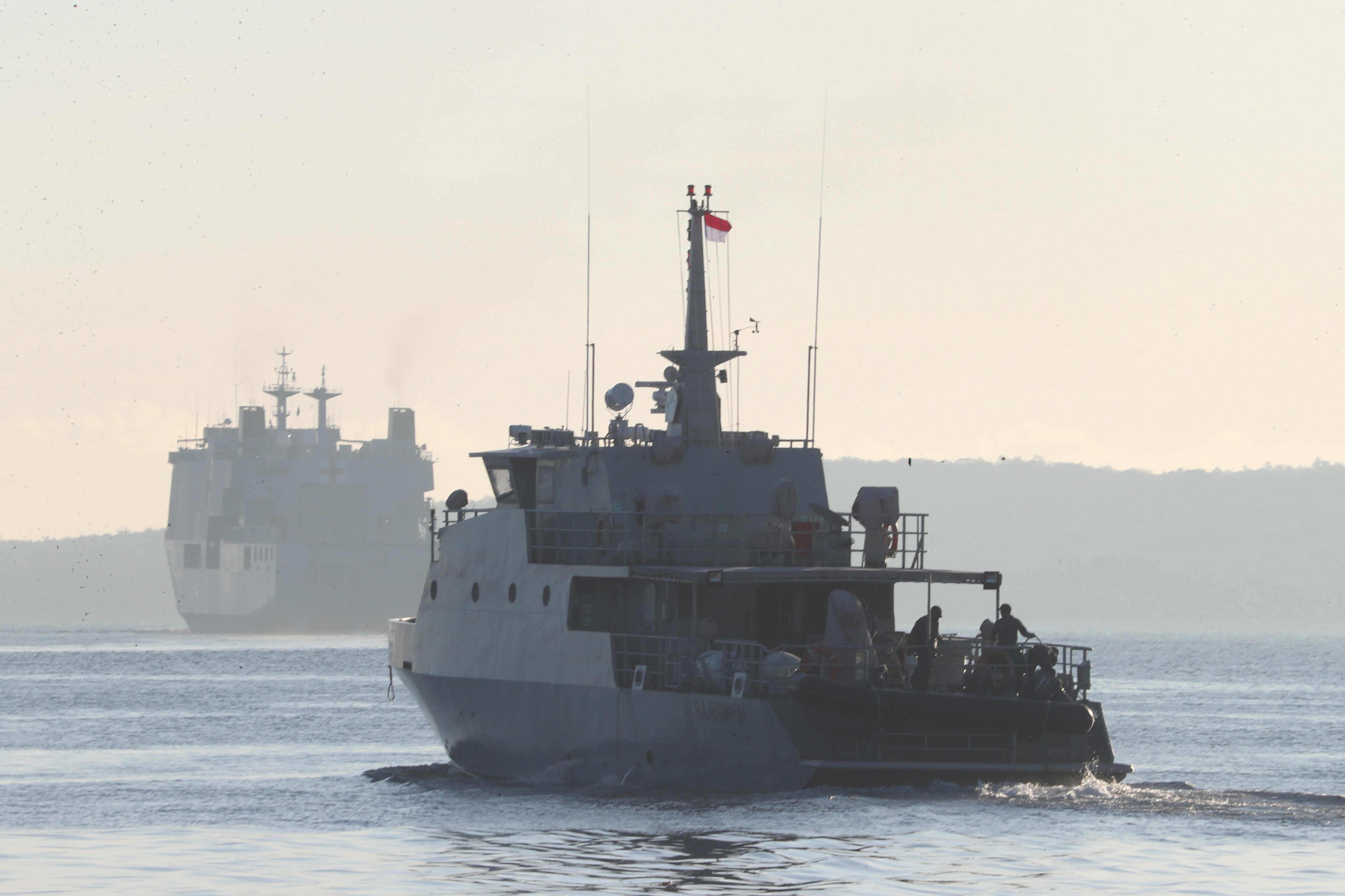 An Indonesian navy patrol ship sails to join the search for submarine KRI Nanggala that went missing while participating in a training exercise